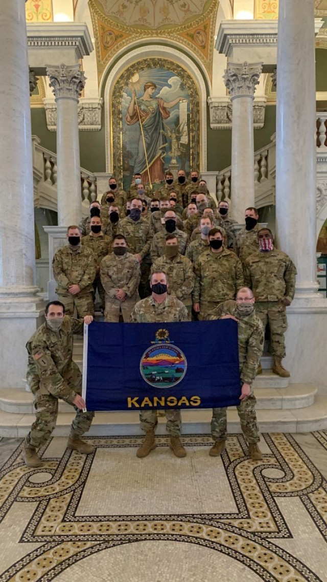 Kansas National Guard Soldiers and Airmen pose with the Kansas flag inside the Library of Congress in Washington, D.C. Jan 24. More than 250 Kansas National Guard Soldiers and Airmen travelled to D.C. Jan. 17 to provide security in support of the...