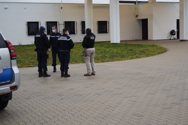 BRUNSSUM, Netherlands -- Sgt. Romale D. Walker Jr., right, military police sergeant at U.S. Army Garrison Benelux, talks to host nation counterparts from the Royal Netherlands Marechaussee (Koninklijke Marachaussee or KMar), a military police...