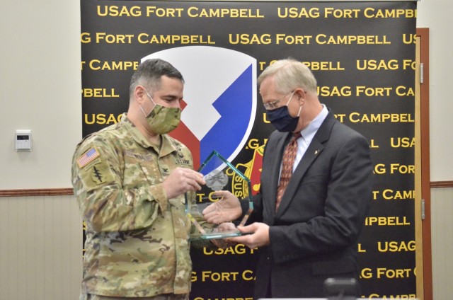 Ted Reece, chief of Fort Campbell Housing Division, Directorate of Public Works, receives the DPW Housing Executive of the Year Award from Col. Jeremy D. Bell, Fort Campbell garrison commander, during a virtual Installation Management Command awards presentation Jan. 28 at Eagle Conference Room.