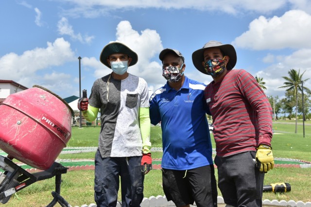 To the delight and enjoyment of enrolled children, the grounds next to the Fort Buchanan Child Youth Center (CYS), is now a 9-hole miniature golf course.  (L to R) Child and Youth Services Program Professionals: Eduardo Avila, Isaac Cruz, José Martinez, did the hard labor to build this course.