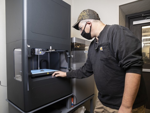 Jeff Thompson, toolmaker supervisor, operates a 3D printer in the machine and weld shop at Anniston Army Depot.  