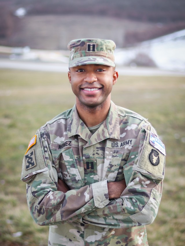 U.S. Army Reserve Capt. Cassian Nuñez, a budget program analyst with the 3rd Medical Command (Deployment Support) based out of Atlanta, Georgia, smiles for a portrait at Camp Bondsteel, Kosovo, on Jan. 22, 2021. Nuñez delivered a speech on Dr. Martin Luther King Jr. day at the base’s dining facility in honor of the civil rights leader. To celebrate Black History Month while deployed, he reflected on the influence his civilian education and military career have shaped his views on race in the U.S. Nuñez said it’s important to honor the sacrifice and achievements of African Americans throughout the year, not just this month. (U.S. Army National Guard photo by Staff Sgt. Tawny Schmit)