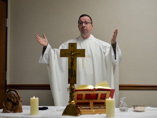 U.S. Air Force Chaplain (Capt.) Pedro Jimenez Barros, a 446th Airlift Wing chaplain, leads mass using online streaming during unit training assembly Jan. 10, 2021 at Joint Base Lewis-McChord, Washington. Jimenez Barros, an ordained Catholic priest originally from Seville, Spain, became a United States citizen on Nov. 20, 2020. (U.S. Air Force photo by Tech. Sgt. Heather Cozad Staley)