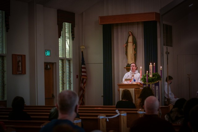 U.S. Air Force Chaplain (Capt.) Pedro Jimenez Barros, a 446th Airlift Wing chaplain, celebrates mass at the base chapel during a unit training assembly on Jan. 10, 2021, Joint Base Lewis-McChord, Washington. Jimenez Barros, an ordained Catholic...
