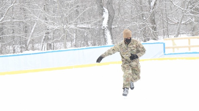 A Soldier assigned to 10th Combat Aviation Brigade spends part of his lunch break getting a quick workout on the ice. So far, 2021 has seen the type of North Country winter weather that is making the Fort Drum ice rink a hot spot for outdoor recreation. Since the rink opened on Jan. 25, it has seen more activity in the first 10 days than all of last season with nearly 800 skaters in attendance. (Photo by Mike Strasser, Fort Drum Garrison Public Affairs)