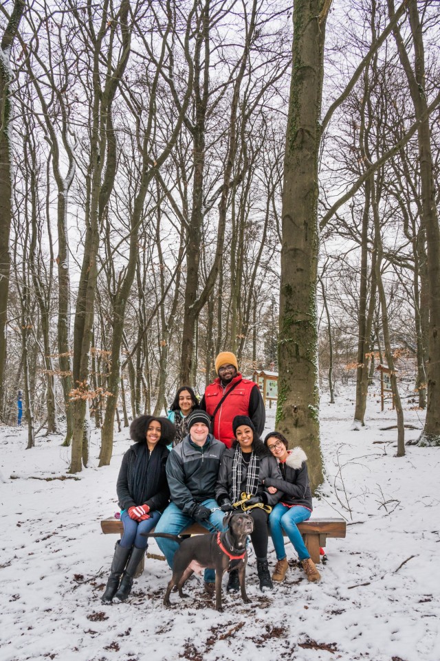WIESBADEN, Germany -- Jessica Tabbert, administrative officer at USAREUR-AF, husband, Master Sgt. Nathan Tabbert, equal opportunity advisor for the 66th Military Intelligence Brigade, and, their four children (Front:  Olesia, 20 and Elaina, 11. Back: Arianna, 13 and Ishaiah, 21) hike in the woods with their dog, Lucky, outside of Wiesbaden Jan. 29, 2021.