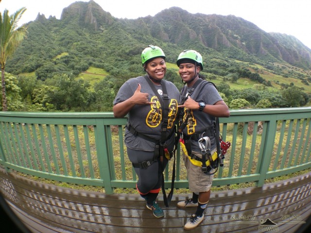 WIESBADEN, Germany – (left to right) Dr. Sturhonda James, Department of Defense cyber security specialist, and her fiancé, Shakima Bates, prepare to zip line Oahu, Hawaii 2017.
