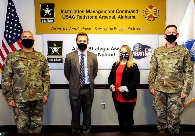 From left are Garrison Command Sgt. Maj. Juan Jimenez, Jordan Matthews, Christina Fults and Garrison Commander Col. Glenn Mellor. Matthews and Fults received the 2020 Army Installation Management Command Stalwart Awards in the IMCOM-Sustainment...