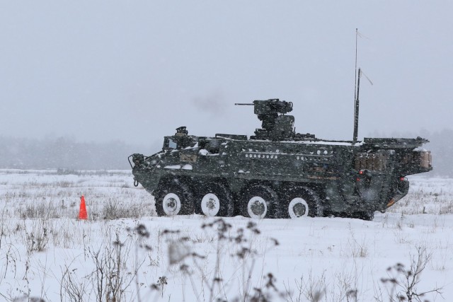 U.S. Army Stryker from Bull Troop, 1st Squadron, 2d Cavalry Regiment, enhanced Forward Presence Battle Group Poland, fires during crew level maneuver platform gunnery qualification tables February 09, 2021, on a snow-covered range at Bemowo Piskie...
