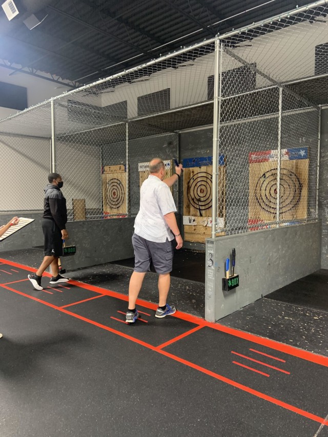 Sgt. Isaiah Harris (left) and 1st Sgt. Troy Isom (right), Soldiers assigned to the Fort Campbell Soldier Recovery Unit, competed in the championship round of an ax throwing event in Sept. 2020 in Clarksville, Tennessee. (Photo courtesy of Dr....