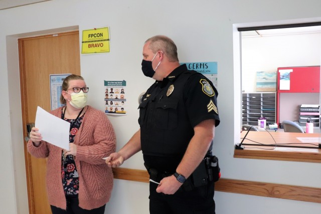 Police Sgt. Kevin Eckelberg with the Directorate of Emergency Services Police Department signs in at the Occupational Health Clinic to receive a COVID-19 vaccination Jan. 28, 2021, at Fort McCoy, Wis. Fort McCoy first started completing COVID-19 vaccinations Jan. 26 at the installation with health care employees, garrison leadership, and first responders receiving the vaccinations. (U.S. Army Photo by Scott T. Sturkol, Public Affairs Office, Fort McCoy, Wis.)