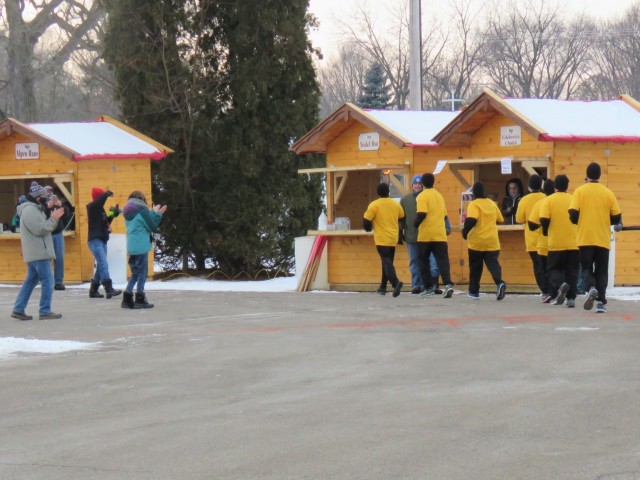 Members of the Fort McCoy, Wis., Army Ten-Miler team carry an event torch Jan. 29, 2021, as part of the opening ceremony of the Sparta Quest Winter Fest in Sparta, Wis. On Jan. 29, members of the team, along with Command Sgt. Maj. Paul Mantha,...