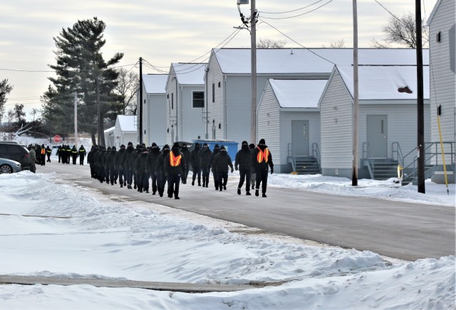 U.S. Navy recruits walk on the cantonment area Jan. 28, 2021, at Fort McCoy, Wis. The Navy’s Recruit Training Command (RTC) of Great Lakes, Ill., worked with the Army at Fort McCoy so the post could serve as a restriction-of-movement (ROM) site for Navy recruits prior to entering basic training. Additional personnel support from the Navy’s Great Lakes, Ill., Millington, Tenn., and Washington, D.C., sites deployed to McCoy to assist RTC in conducting the initial 14-day ROM to help reduce the risk of bringing the coronavirus to RTC should any individual be infected. More than 40,000 recruits train annually at the Navy’s only boot camp. This is also the first time Fort McCoy has supported the Navy in this capacity. Fort McCoy’s motto is to be the “Total Force Training Center.” (U.S. Army Photo by Scott T. Sturkol, Public Affairs Office, Fort McCoy, Wis.)