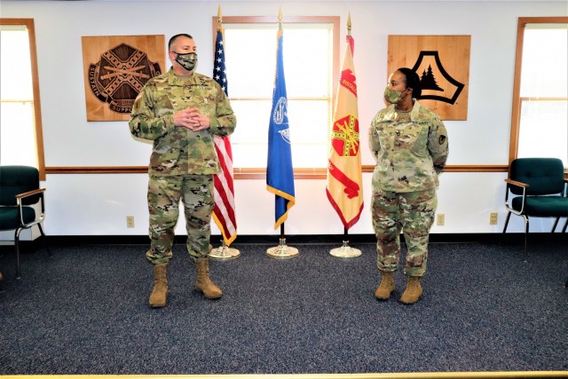 Fort McCoy Garrison Commander Col. Michael D. Poss prepares to present Master Sgt. Cynthia P. Johnson with an Army Meritorious Service Medal on Jan. 22, 2021, at the garrison headquarters building at Fort McCoy, Wis. Johnson earned the medal for meritorious service with Fort McCoy Garrison between 2018 and 2021. (U.S. Army Photo by Scott T. Sturkol, Public Affairs Office, Fort McCoy, Wis.)