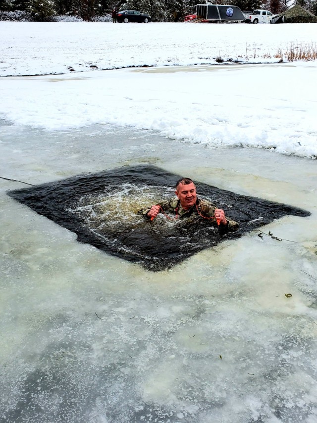Fort McCoy Garrison Commander Col. Michael D. Poss participates in a cold-water immersion familiarization event Jan. 15, 2021, at Fort McCoy, Wis. Poss was learning about this training event that is part of the Fort McCoy Cold-Weather Operations...