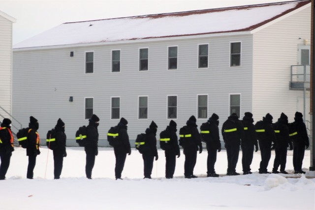 U.S. Navy recruits walk to a dining facility Jan. 28, 2021, at Fort McCoy, Wis. The Navy’s Recruit Training Command (RTC) of Great Lakes, Ill., worked with the Army in 2020 at Fort McCoy so the post could serve as a restriction-of-movement (ROM)...