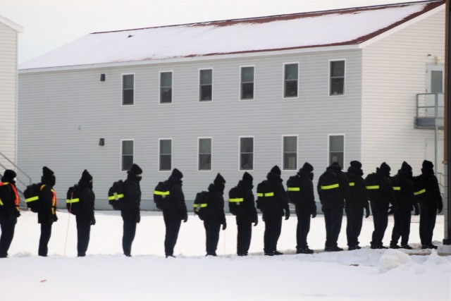 U.S. Navy recruits walk to a dining facility Jan. 28, 2021, at Fort McCoy, Wis. The Navy’s Recruit Training Command (RTC) of Great Lakes, Ill., worked with the Army in 2020 at Fort McCoy so the post could serve as a restriction-of-movement (ROM) site for Navy recruits prior to entering basic training. Additional personnel support from the Navy’s Great Lakes, Ill., Millington, Tenn., and Washington, D.C., sites deployed to McCoy to assist RTC in conducting the initial 14-day ROM to help reduce the risk of bringing the coronavirus to RTC should any individual be infected. More than 40,000 recruits train annually at the Navy’s only boot camp. This is also the first time Fort McCoy has supported the Navy in this capacity. Fort McCoy’s motto is to be the “Total Force Training Center.” (U.S. Army Photo by Scott T. Sturkol, Public Affairs Office, Fort McCoy, Wis.)