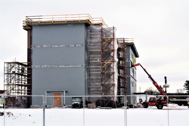 Construction of a new multi-million dollar transient troop training barracks is shown Jan. 26, 2021, at Fort McCoy, Wis. Contractor L.S. Black Constructors was awarded a $20.6 million contract to build the barracks in September 2019. The planned completion date is currently August 2021. The planned barracks will be different than the traditional barracks that are located throughout the installation. This new building is four stories and be able to house 400 people in approximately 60,000 square feet. The project also is the first of eight new buildings planned for the entire 1600 block at Fort McCoy. The plan is to build three more barracks with the same specifications, three 20,000-square-foot brigade headquarters buildings, and one 160-room officer quarters. This is an Army Corps of Engineers-managed project. (U.S. Army Photo by Scott T. Sturkol, Public Affairs Office, Fort McCoy, Wis.)