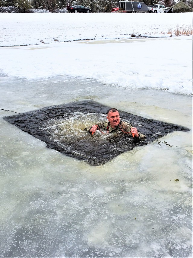 Fort McCoy Garrison Commander Col. Michael D. Poss participates in a cold-water immersion familiarization event Jan. 15, 2021, at Fort McCoy, Wis. Poss was learning about this training event that is part of the Fort McCoy Cold-Weather Operations...