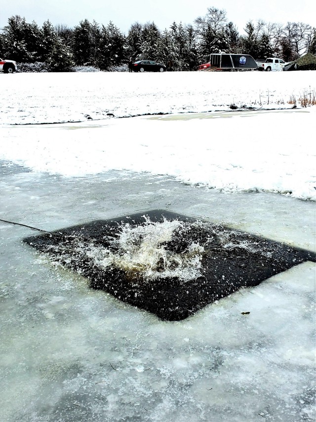 Fort McCoy Garrison Commander Col. Michael D. Poss participates in a cold-water immersion familiarization event Jan. 15, 2021, at Fort McCoy, Wis. Poss was learning about this training event that is part of the Fort McCoy Cold-Weather Operations...