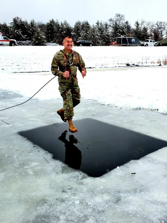 Fort McCoy Garrison Commander Col. Michael D. Poss participates in a cold-water immersion familiarization event Jan. 15, 2021, at Fort McCoy, Wis. Poss was learning about this training event that is part of the Fort McCoy Cold-Weather Operations...
