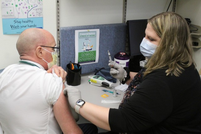 A post medical person receives a COVID-19 vaccination Jan. 26, 2021, at the Fort McCoy Health Clinic during the first round of COVID-19 vaccinations at Fort McCoy, Wis. Several people received the vaccine at the post Jan. 26. The effort was the...