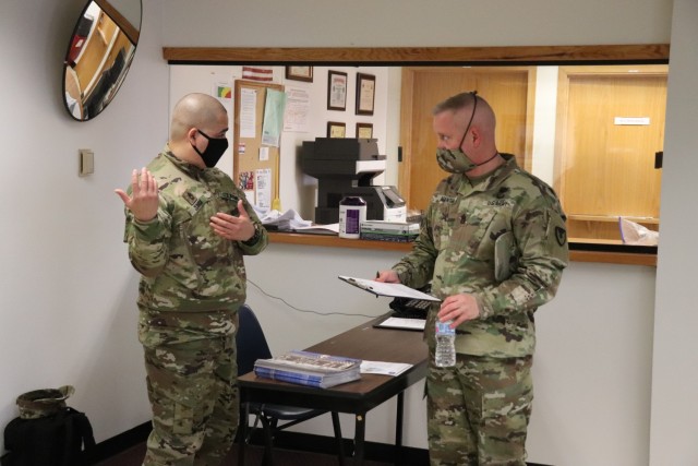 Post personnel receive paperwork to complete in order to receive a COVID-19 vaccination Jan. 26, 2021, at the Fort McCoy Health Clinic during the first round of COVID-19 vaccinations at Fort McCoy, Wis. Several people received the vaccine at the post Jan. 26. The effort was the beginning of many rounds of vaccinations at the installation. The COVID-19 vaccine is now available due in large part to the Department of Defense effort for Operation Warp Speed to get vaccines to the American people. (U.S. Army Photo by Scott T. Sturkol, Public Affairs Office, Fort McCoy, Wis.)