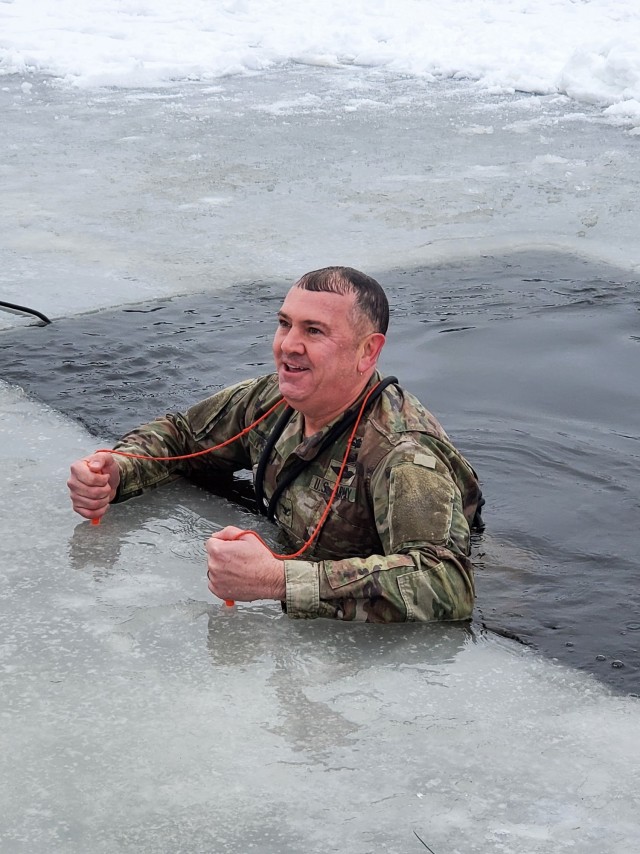 Fort McCoy Garrison Commander Col. Michael D. Poss participates in a cold-water immersion familiarization event Jan. 15, 2021, at Fort McCoy, Wis. Poss was learning about this training event that is part of the Fort McCoy Cold-Weather Operations...