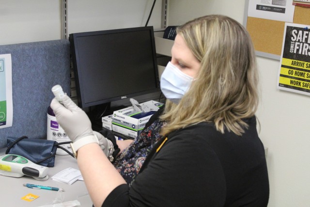 Erica Miller, a registered nurse with the Fort McCoy Health Clinic, prepares a COVID-19 vaccination Jan. 26, 2021, during the first round of COVID-19 vaccinations at Fort McCoy, Wis. Several people received the vaccine at the post Jan. 26. The...