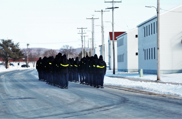 U.S. Navy recruits walk on the cantonment area Jan. 28, 2021, at Fort McCoy, Wis. The Navy’s Recruit Training Command (RTC) of Great Lakes, Ill., worked with the Army in 2020 at Fort McCoy so the post could serve as a restriction-of-movement (ROM) site for Navy recruits prior to entering basic training. Additional personnel support from the Navy’s Great Lakes, Ill., Millington, Tenn., and Washington, D.C., sites deployed to McCoy to assist RTC in conducting the initial 14-day ROM to help reduce the risk of bringing the coronavirus to RTC should any individual be infected. More than 40,000 recruits train annually at the Navy’s only boot camp. This is also the first time Fort McCoy has supported the Navy in this capacity. Fort McCoy’s motto is to be the “Total Force Training Center.” (U.S. Army Photo by Scott T. Sturkol, Public Affairs Office, Fort McCoy, Wis.)