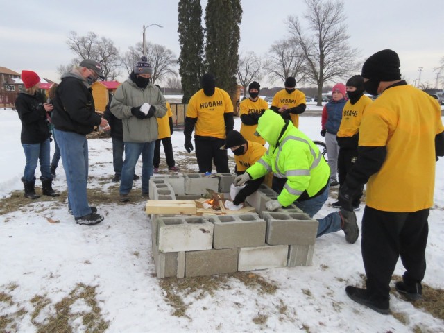 Members of the Fort McCoy, Wis., Army Ten-Miler team carry an event torch Jan. 29, 2021, as part of the opening ceremony of the Sparta Quest Winter Fest in Sparta, Wis. On Jan. 29, members of the team, along with Command Sgt. Maj. Paul Mantha,...