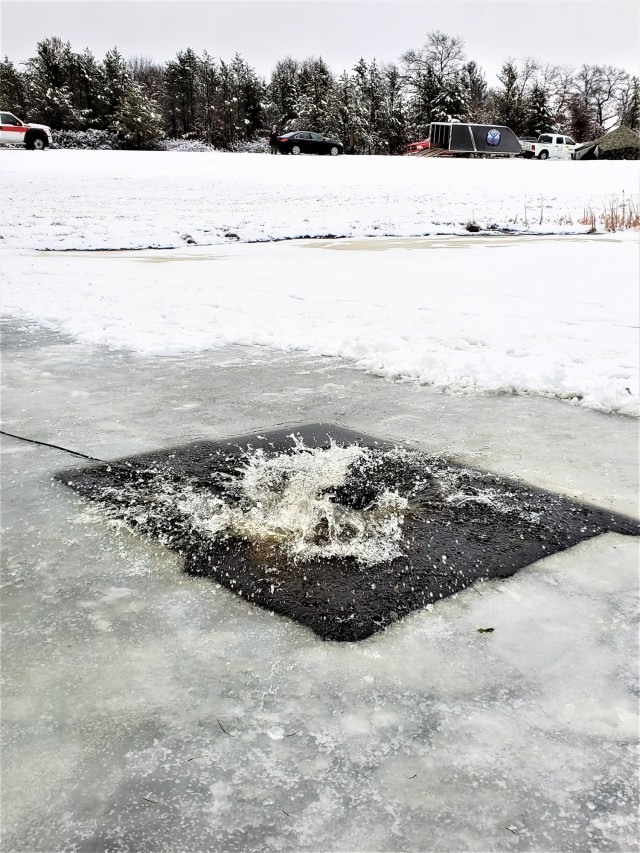 Fort McCoy Garrison Commander Col. Michael D. Poss participates in a cold-water immersion familiarization event Jan. 15, 2021, at Fort McCoy, Wis. Poss was learning about this training event that is part of the Fort McCoy Cold-Weather Operations...