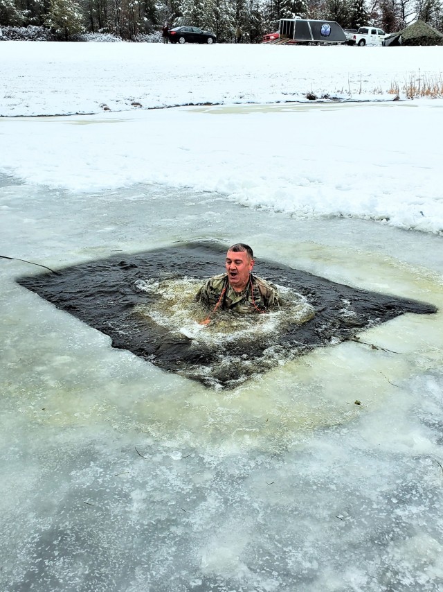 Fort McCoy Garrison Commander Col. Michael D. Poss participates in a cold-water immersion familiarization event Jan. 15, 2021, at Fort McCoy, Wis. Poss was learning about this training event that is part of the Fort McCoy Cold-Weather Operations...