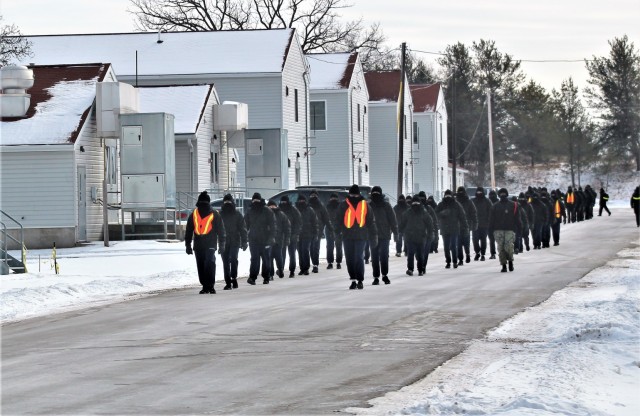 U.S. Navy recruits walk on the cantonment area Jan. 28, 2021, at Fort McCoy, Wis. The Navy’s Recruit Training Command (RTC) of Great Lakes, Ill., worked with the Army at Fort McCoy so the post could serve as a restriction-of-movement (ROM) site...
