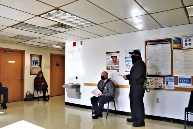 Emergency services personnel with the Directorate of Emergency Services wait at the Occupational Health Clinic to receive a COVID-19 vaccination Jan. 28, 2021, at Fort McCoy, Wis. Fort McCoy first started completing COVID-19 vaccinations Jan. 26 at the installation with health care employees, garrison leadership, and first responders receiving the vaccinations. (U.S. Army Photo by Scott T. Sturkol, Public Affairs Office, Fort McCoy, Wis.)