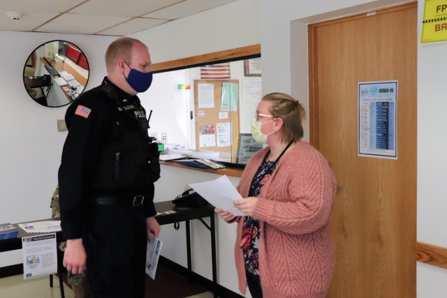 Police Officer Matthew Brigson with the Directorate of Emergency Services Police Department signs in at the Occupational Health Clinic to receive a COVID-19 vaccination Jan. 28, 2021, at Fort McCoy, Wis. Fort McCoy first started completing COVID-19 vaccinations Jan. 26 at the installation with health care employees, garrison leadership, and first responders receiving the vaccinations. (U.S. Army Photo by Scott T. Sturkol, Public Affairs Office, Fort McCoy, Wis.)