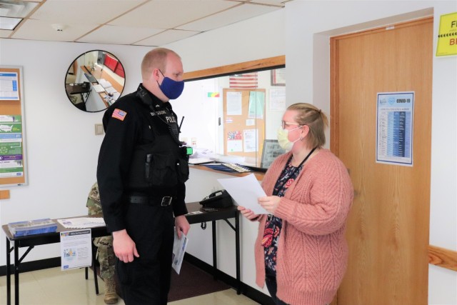 Police Officer Matthew Brigson with the Directorate of Emergency Services Police Department signs in at the Occupational Health Clinic to receive a COVID-19 vaccination Jan. 28, 2021, at Fort McCoy, Wis. Fort McCoy first started completing COVID-19 vaccinations Jan. 26 at the installation with health care employees, garrison leadership, and first responders receiving the vaccinations. (U.S. Army Photo by Scott T. Sturkol, Public Affairs Office, Fort McCoy, Wis.)