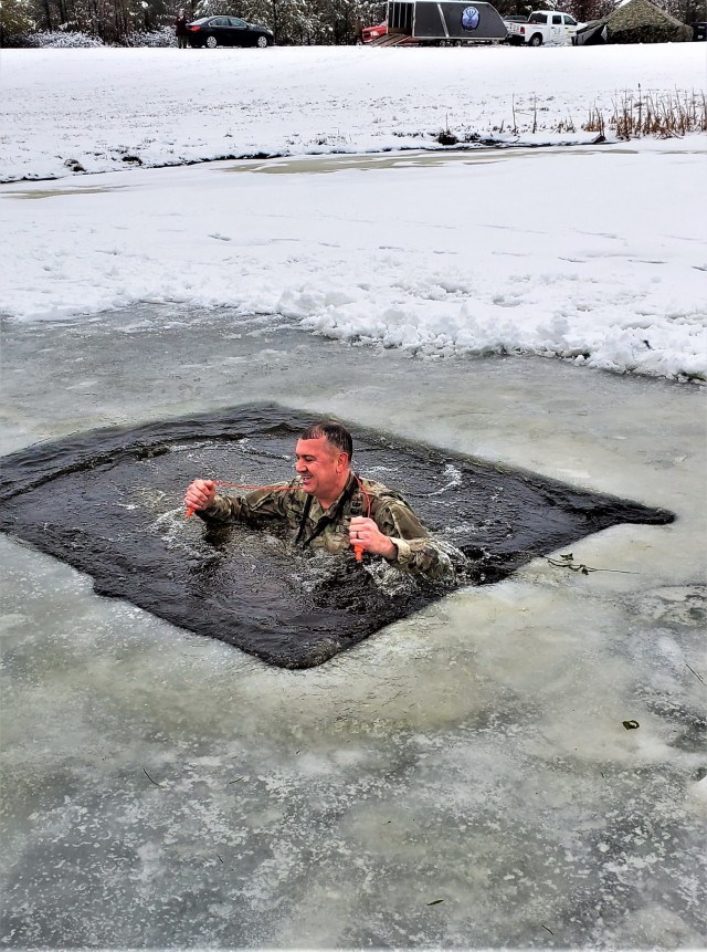 Fort McCoy Garrison Commander Col. Michael D. Poss participates in a cold-water immersion familiarization event Jan. 15, 2021, at Fort McCoy, Wis. Poss was learning about this training event that is part of the Fort McCoy Cold-Weather Operations...
