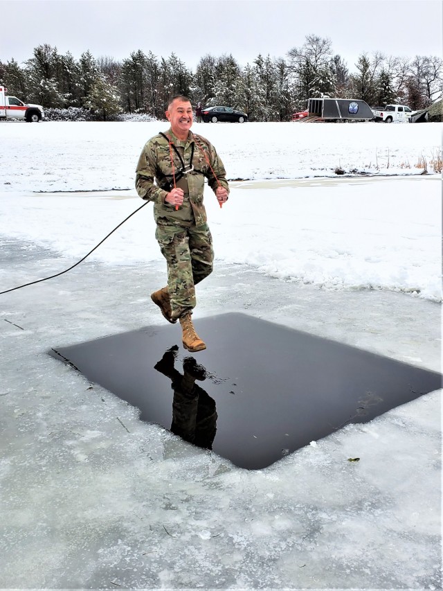 Fort McCoy Garrison Commander Col. Michael D. Poss participates in a cold-water immersion familiarization event Jan. 15, 2021, at Fort McCoy, Wis. Poss was learning about this training event that is part of the Fort McCoy Cold-Weather Operations...