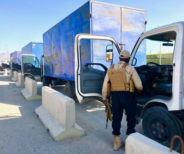 A contractor conducts vehicle checks as part of Army Contracting Command-Rock Island’s Private Security Contract at Bagram Air Field (BAF), Afghanistan. (Courtesy photo)