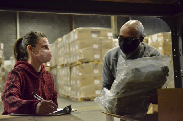 Army Field Support Battalion-Campbell warehouse specialist Jaslin Steiner and stock clerk Terry Taylor take inventory Feb. 9 as AFSBn-Campbell prepares to move its chemical protective equipment into a new warehouse.