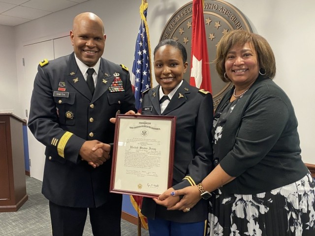 Lt. Gen. Leslie Smith, the Army's inspector general, swore in his daughter, 2nd Lt. Tori Smith, who is now attending medical school at Howard University to become an Army nurse. Also pictured is Smith's wife, Vanedra.