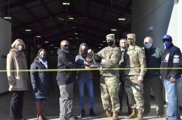 Members of Army Field Support Battalion-Campbell unveil a new individual chemical equipment facili-ty, or IceFAC, warehouse Feb. 5 that will house chemical protective equipment for the 101st Airborne Division (Air Assault).