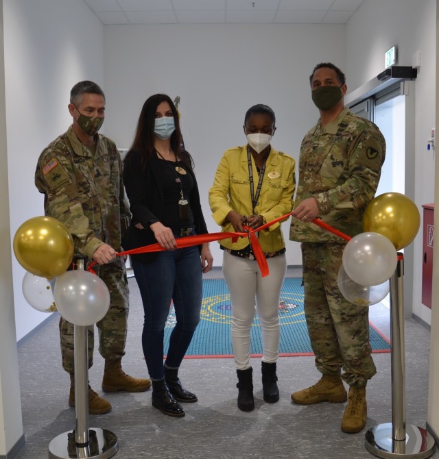 Post employees, Elem Thomas and Annette Kamunya, along with Col. Mario Washington and Command Sgt. Maj. Christopher Truchon, the U.S. Army Garrison Wiesbaden commander and command sergeant major, cut the ribbon officially opening the new post...