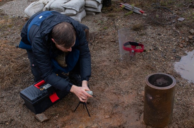 A student with Mine Action Training Kosovo places a precision explosive during a MAT Kosovo range day outside Dakovica/Gjakovë, Kosovo, on Feb. 11, 2021. MAT Kosovo practices a variety of techniques designed to safely detonate unexploded ordnance.