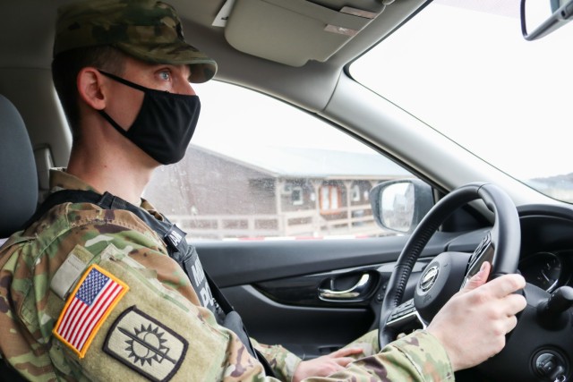 Sgt. 1st Class Michael Raines, provost sergeant for Regional Command-East, Kosovo Force 28, responds to a joint force protection exercise at Camp Bondsteel, Kosovo, on Jan. 23, 2021. A mock/notional vehicle-born improvised explosive device was detected at the main gate, initiating a cooperative process between military police, security contractors, medical and fire department personnel, and the explosive ordnance disposal team to secure the area and eliminate the threat. Raines, a Maryland Army National Guard Soldier, observed the exercise to help ensure all response procedures were executed efficiently. (U.S. Army National Guard photo by Staff Sgt. Tawny Schmit)