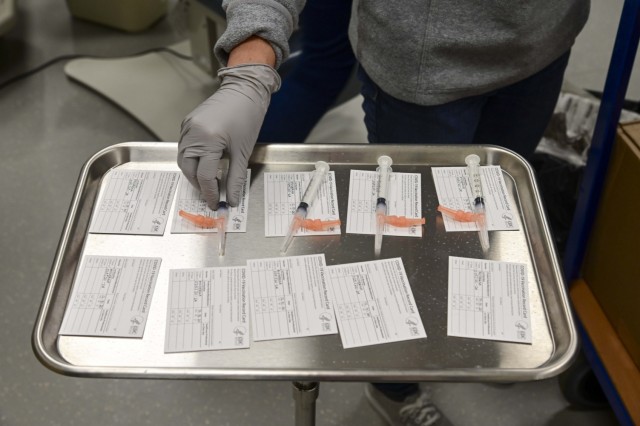 A nurse prepares the Moderna COVID-19 vaccine for distribution at Army Health clinic Stuttgart on Dec. 31, 2020.