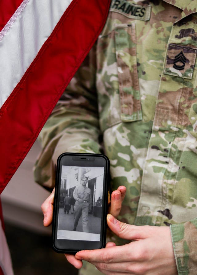 Sgt. 1st Class Michael Raines, a military police Soldier with the 29th Military Police Company, Maryland Army National Guard, displays a photo of his grandfather, Lawrence H. Raines, outside his office at Camp Bondsteel, Kosovo, on Feb. 13, 2021. His grandfather was a military police Soldier and served in France during World War II. (U.S. Army National Guard photo by Staff Sgt. Tawny Schmit)