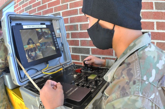 Sgt. Lloyd Pagala uses a controller to maneuver an explosive ordnance disposal robot during an EOD Specialist Course robotics familiarization Feb. 4 at Rose Hall located on the Ordnance Campus. Pagala was in the final week of the seven-week phase...