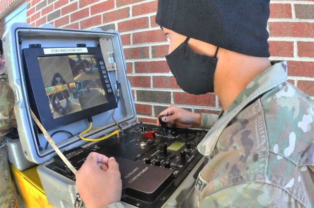 Sgt. Lloyd Pagala uses a controller to maneuver an explosive ordnance disposal robot during an EOD Specialist Course robotics familiarization Feb. 4 at Rose Hall located on the Ordnance Campus. Pagala was in the final week of the seven-week phase I course. Phase II takes place at Eglin Air Force Base, Fla., and is seven months long.